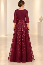 Burgundy mother of the bride dress with sequin floral skirt and zipper back design