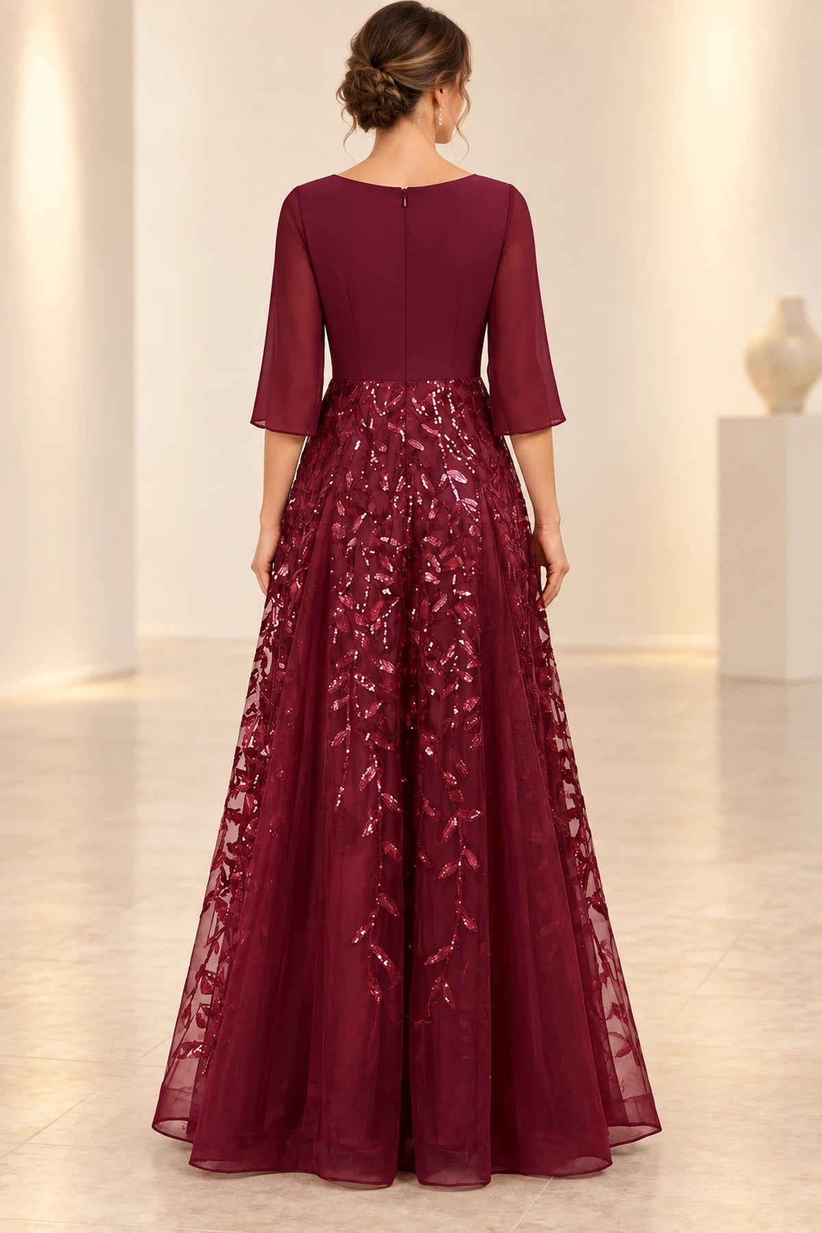 Burgundy mother of the bride dress with sequin floral skirt and zipper back design