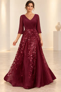 Burgundy mother of the bride dress with V neckline three quarter sleeves and sequin A line skirt