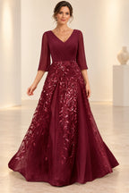 Burgundy mother of the bride dress with V neckline three quarter sleeves and sequin A line skirt