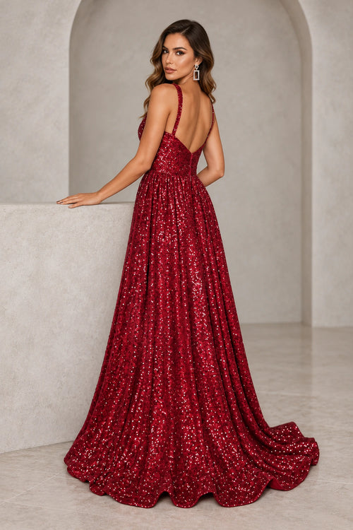 Burgundy sequined prom dress featuring a low V back, center-back zipper, gathered A line skirt, and gentle train.
