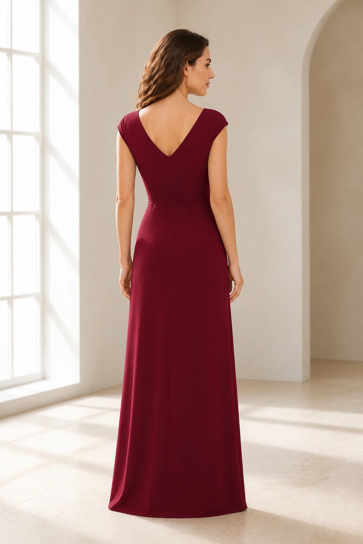Back view of Vedress burgundy wedding guest dress with V back, cap sleeves, gathered waist and long A line silhouette