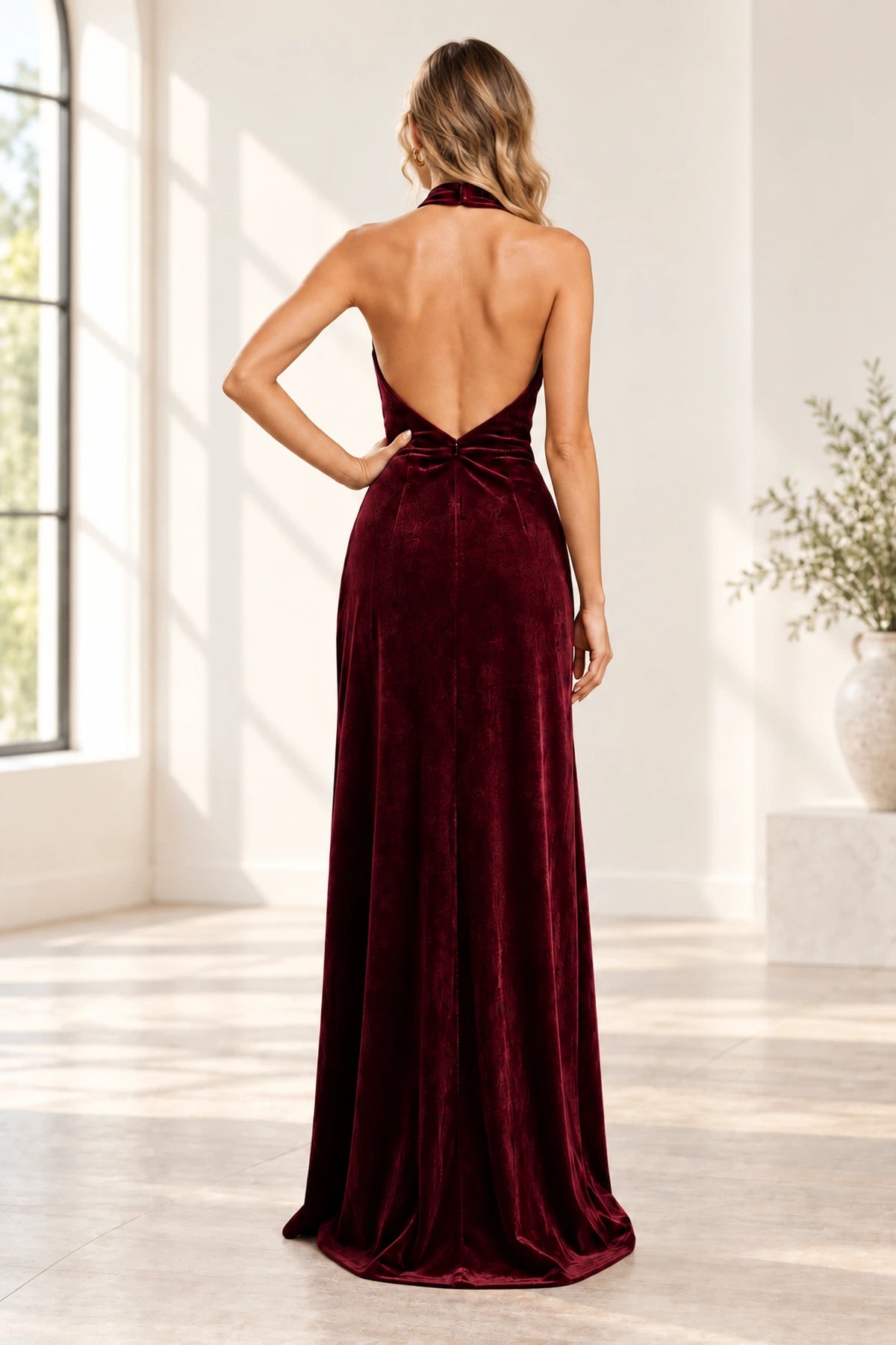 Burgundy velvet open back halter bridesmaid dress with flowing skirt