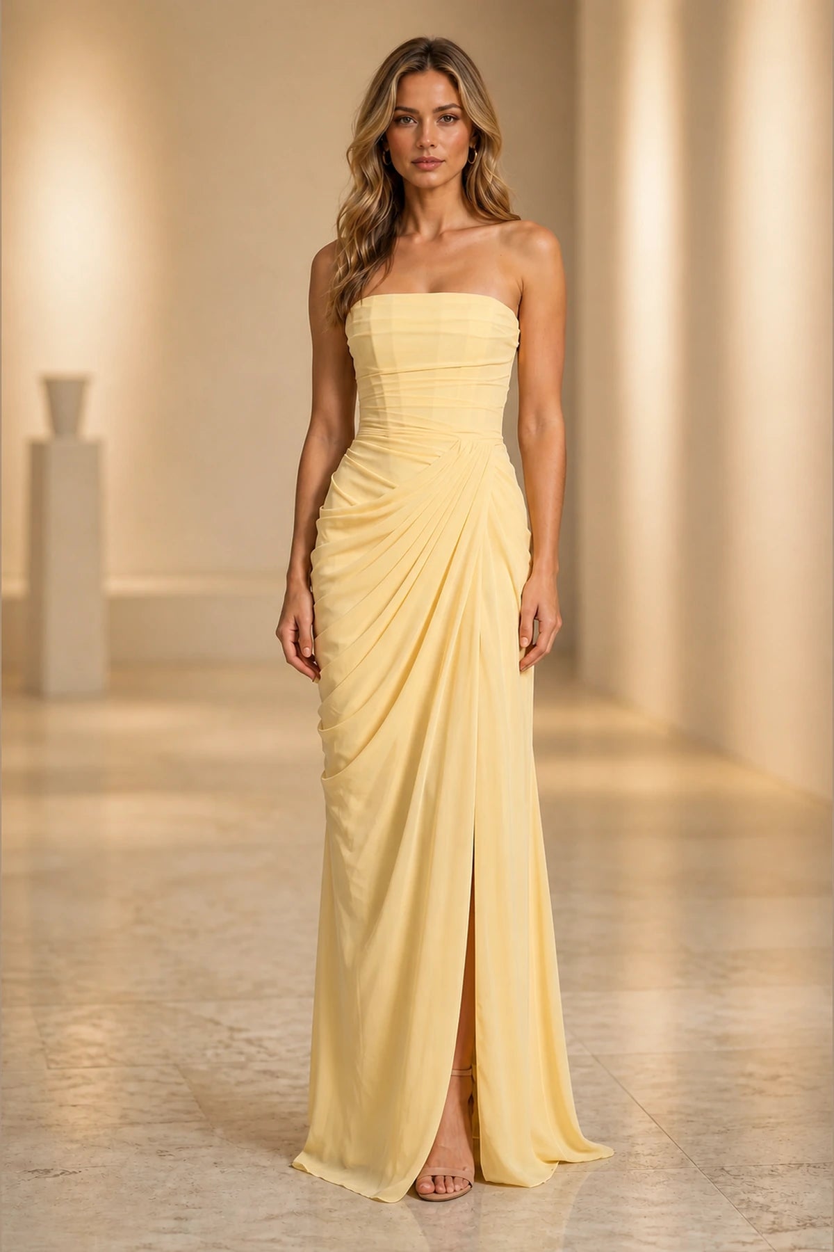 Butter yellow strapless floor-length bridesmaid dress with ruched waist and front slit