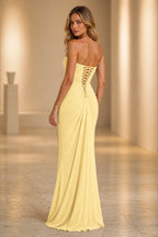 Butter yellow strapless bridesmaid dress with lace-up back and draped floor-length skirt