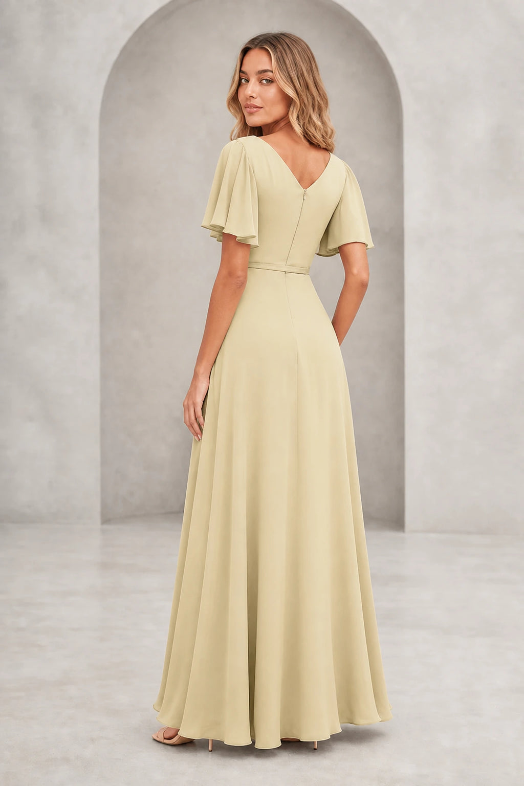 Vedress light champagne A-line mother of the bride dress with bateau neckline, flutter sleeves, waist tie, V-back and floor-length skirt