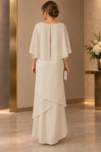 Back view of champagne Mother of the Bride Dress with cape overlay, keyhole back and layered floor-length chiffon skirt