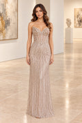 Champagne beaded mermaid prom dress with sweetheart neckline and fitted silhouette
