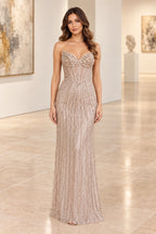 Champagne beaded mermaid prom dress with sweetheart neckline and fitted silhouette