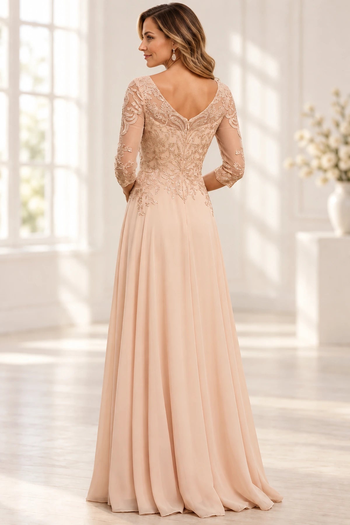 Back view of champagne blush Mother of the Bride Dress with V-back, lace detailing, center zipper and floor-length A-line skirt
