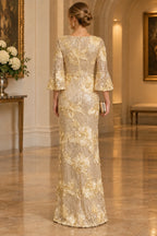 Back view of champagne gold Mother of the Bride Dress with bell sleeves, sequin floral detailing and floor-length sheath silhouette