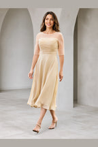 Vedress champagne A-line mother of the bride dress with illusion bateau neckline elbow sleeves ruched bodice and tea-length skirt front view