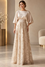 Champagne Mother of the Bride Dress with bateau neckline, cape sleeves, ruched waist and floral lace skirt