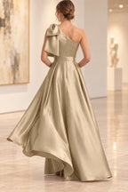 Back view of champagne Mother of the Bride Dress with one-shoulder neckline, bow detail, and floor-length silhouette