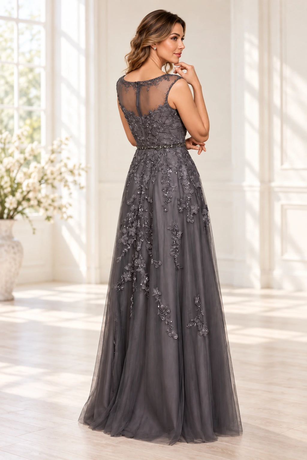 Back view of charcoal gray Mother of the Bride Dress with sheer illusion lace back and floor-length A-line skirt