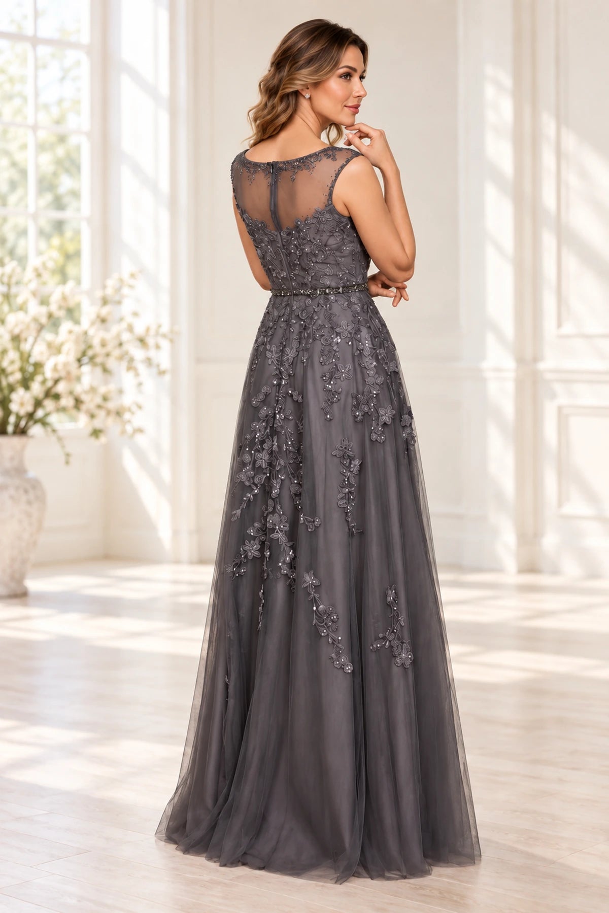Back view of charcoal gray Mother of the Bride Dress with sheer illusion lace back and floor-length A-line skirt