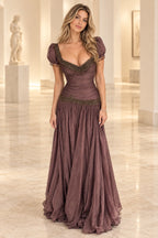 Graceprom mauve chiffon prom dress with a beaded sweetheart neckline, fringe puff sleeves, ruched bodice and flowing dropped waist skirt.