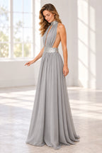 Front view of a gray Graceprom chiffon prom dress with a sparkling halter collar, deep keyhole bodice, embellished waistband and flowing A-line skirt.