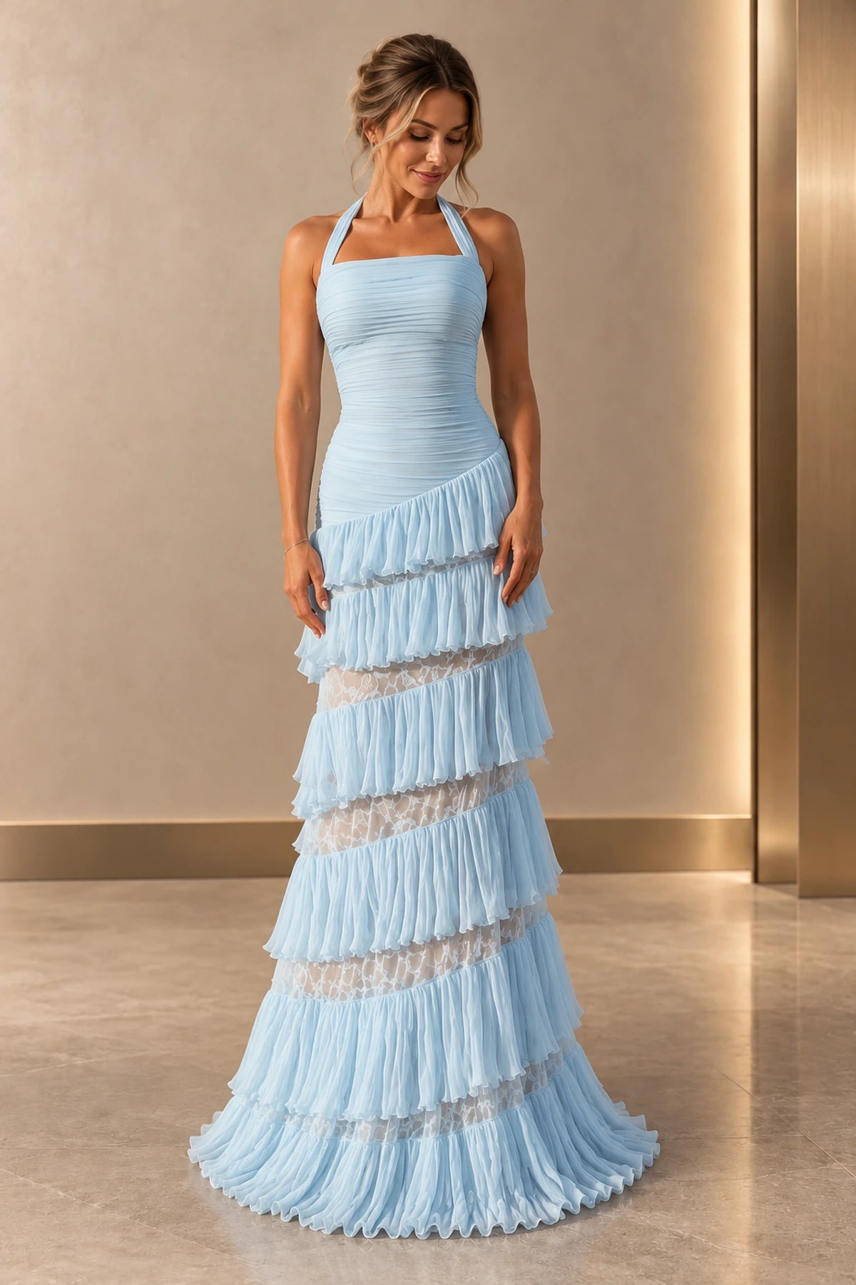 Front view of a light blue Graceprom halter prom dress with a ruched bodice, asymmetric chiffon ruffle tiers and sheer floral lace skirt bands.