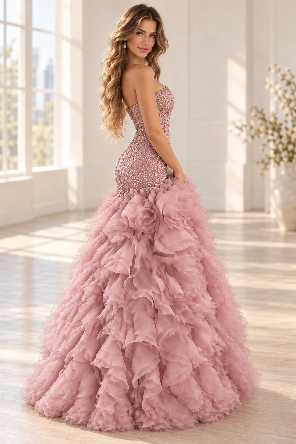 Rear three-quarter view of Graceprom dusty rose prom dress with a low sequin back, dimensional roses and a sweeping chiffon ruffle train.