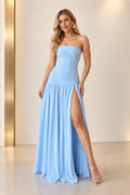 Light blue chiffon strapless prom dress with straight neckline, fitted drop waist, high thigh slit and flowing floor length skirt by Graceprom