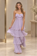 Front view of a lavender Graceprom chiffon prom dress with a strapless sweetheart neckline, ruffle overlay, ruched bodice and four-tier skirt.