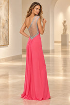 Coral pink prom dress with beaded illusion back design and flowing floor length chiffon skirt
