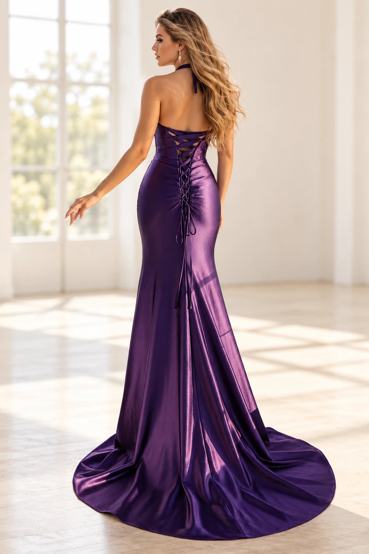Back view of dark purple mermaid prom dress with halter neck ties, adjustable lace-up corset back and sweeping train