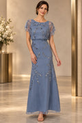 Dusty blue mother of the bride dress with illusion neckline cape sleeves and silver beaded detail