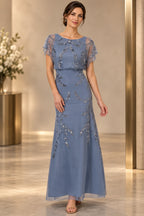 Dusty blue mother of the bride dress with illusion neckline cape sleeves and silver beaded detail