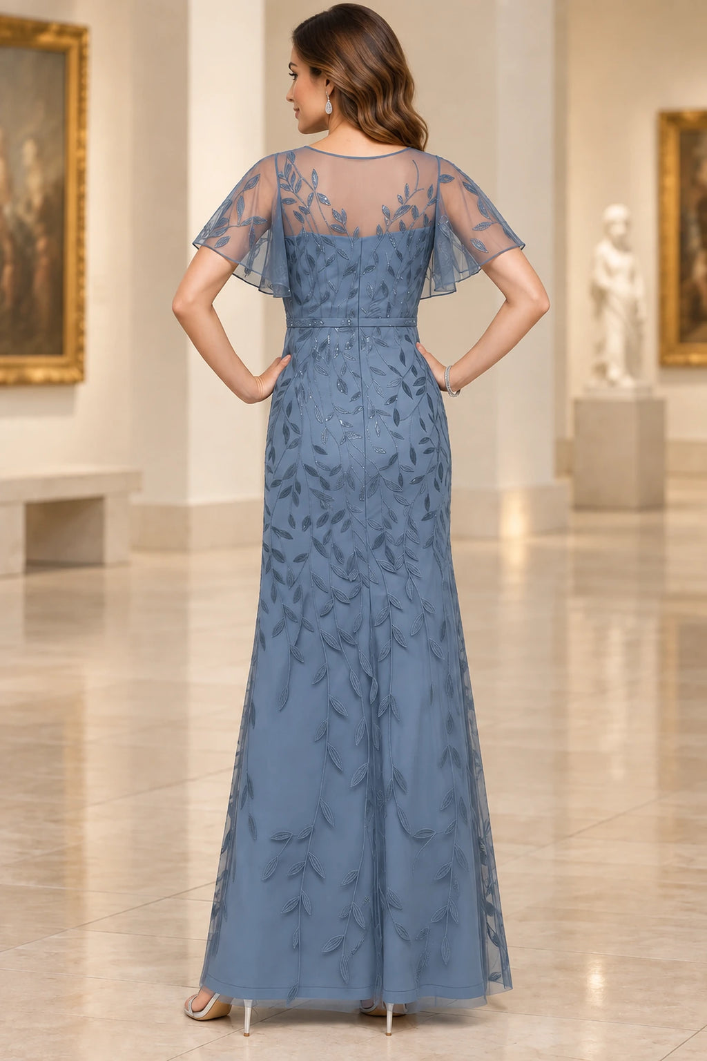 Dusty blue mother of the bride dress with embroidered illusion back flutter sleeves and long skirt