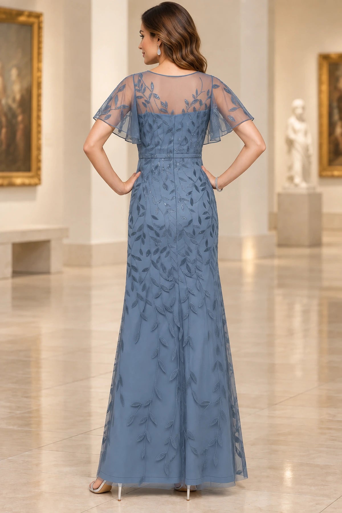 Dusty blue mother of the bride dress with embroidered illusion back flutter sleeves and long skirt