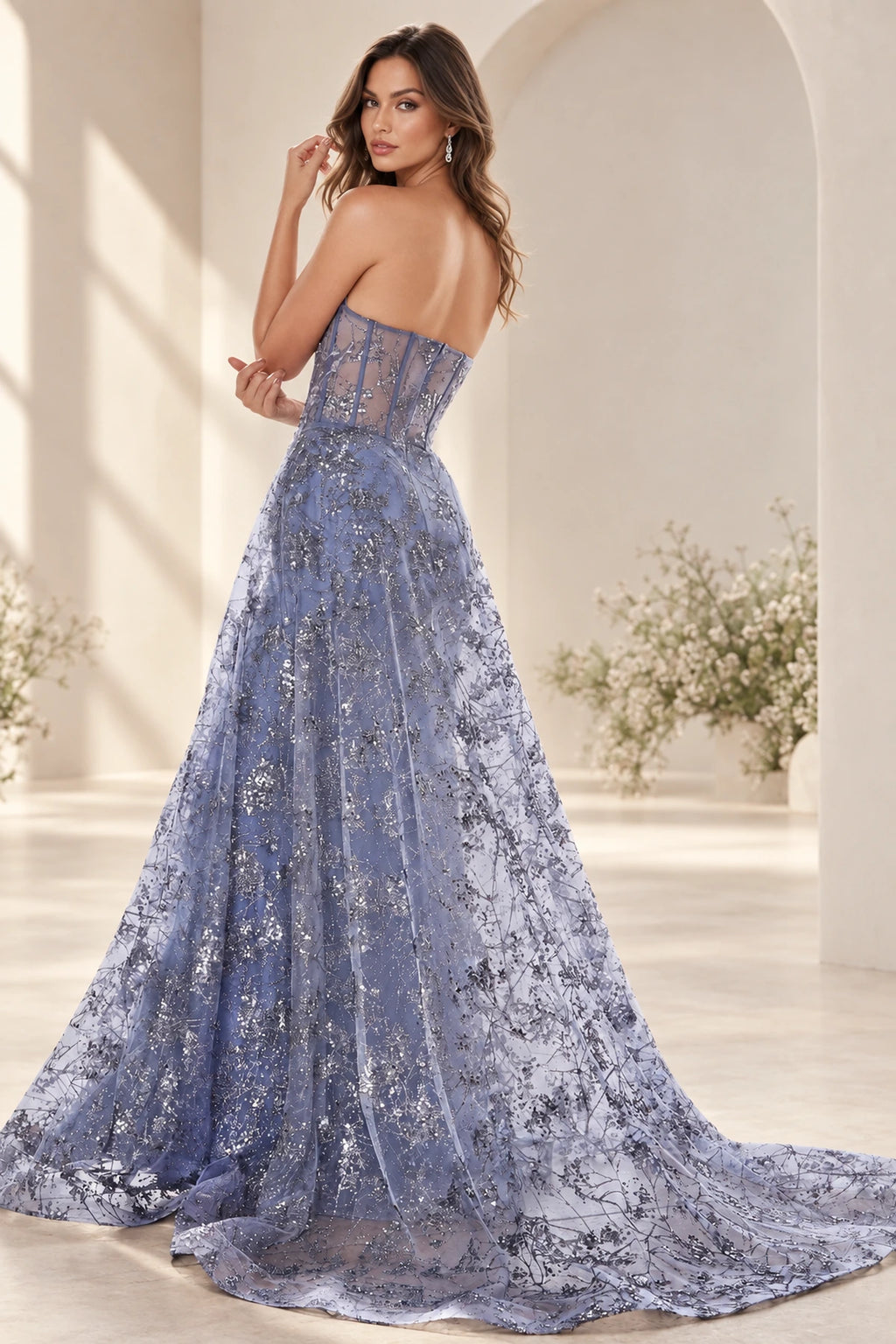 Dusty blue prom dress with sheer corset back and dramatic floral overskirt train