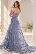 Dusty blue prom dress with sheer corset back and dramatic floral overskirt train