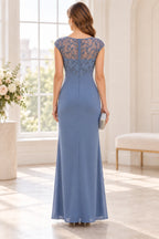 Back view of dusty blue Mother of the Bride Dress with sheer embroidered back, cap sleeves and floor-length sheath skirt