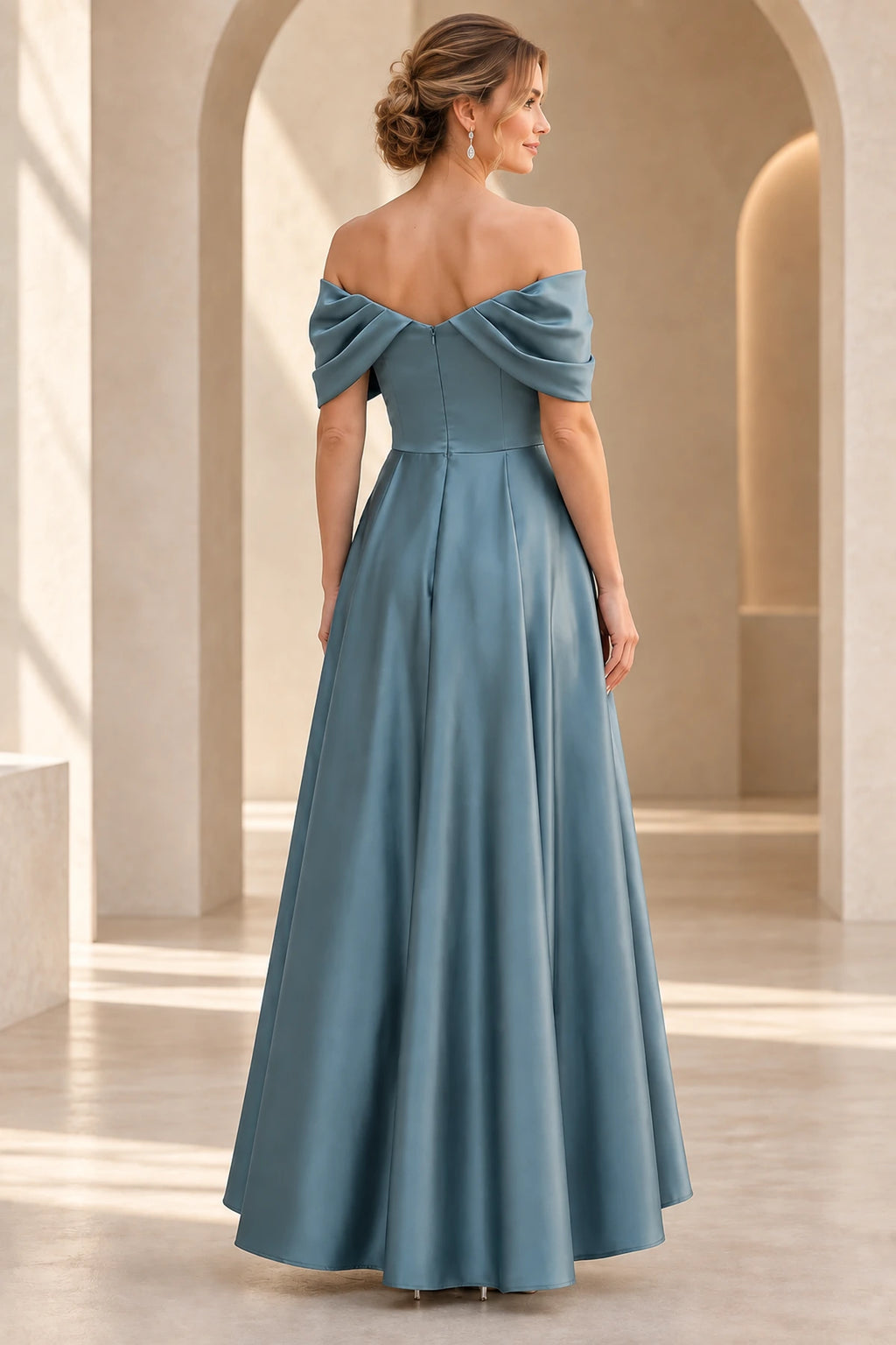 Back view of dusty blue Mother of the Bride Dress with draped off-shoulder neckline, center zipper and long flowing skirt