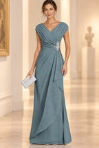 Dusty blue Mother of the Bride Dress with V-neck, pleated bodice, floral waist detail and flowing floor-length skirt