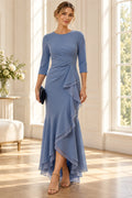 Dusty blue mother of the bride dress with round neckline three quarter sleeves and layered ruffle skirt