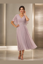 Vedress dusty mauve mother of the bride dress with V-neck flutter sleeves ruched waist floral applique and tea-length A-line skirt front view