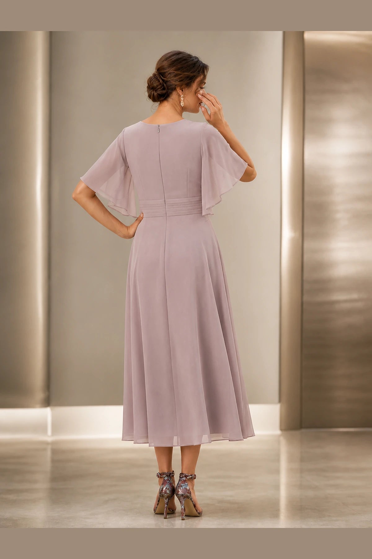 Vedress dusty mauve mother of the bride dress with flutter sleeves zipper back defined waist and tea-length A-line skirt back view