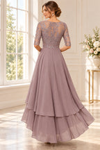 Dusty mauve mother of the bride dress with embellished lace back and flowing chiffon layers