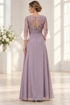 Back view of dusty mauve Mother of the Bride Dress with lace appliqué bodice, keyhole back and floor-length skirt