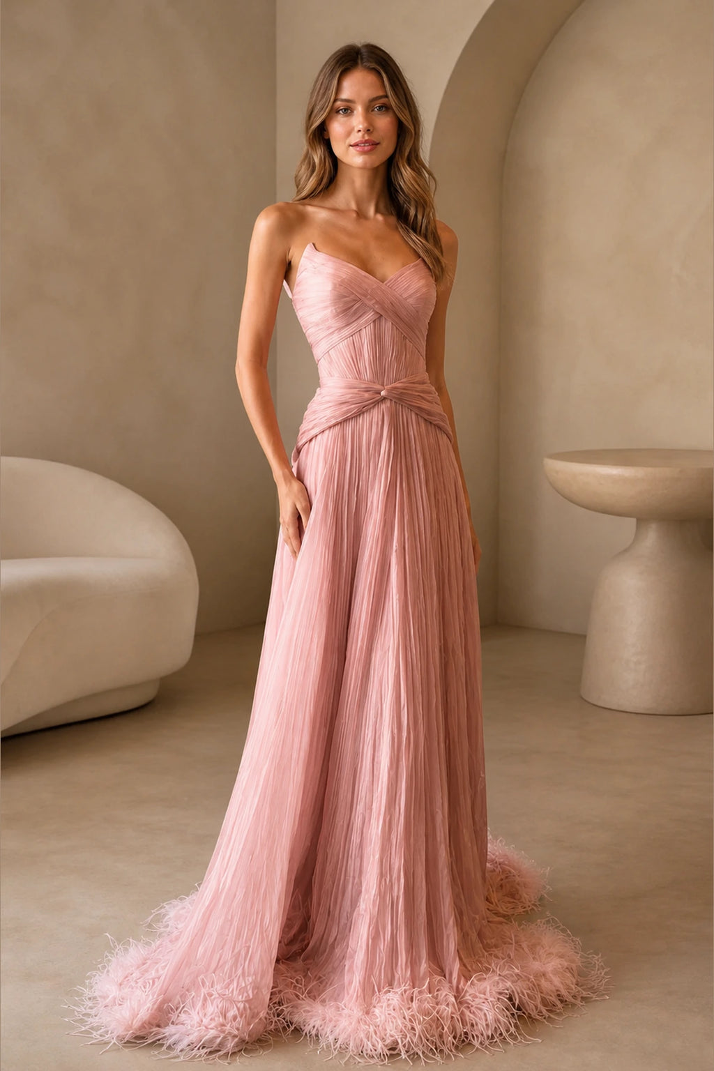 GraceProm dusty pink strapless prom dress with sweetheart neckline pleated bodice feather trim and floor length A-line skirt