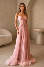 GraceProm dusty pink strapless prom dress with sweetheart neckline pleated bodice feather trim and floor length A-line skirt