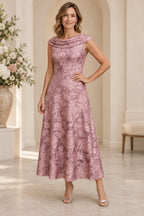 Dusty rose mother of the bride dress with cowl neckline floral lace and tea length A line skirt