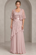 Dusty rose A-line Mother of the Bride Dress with sweetheart neckline, lace cape overlay, satin waistband and layered floor-length chiffon skirt