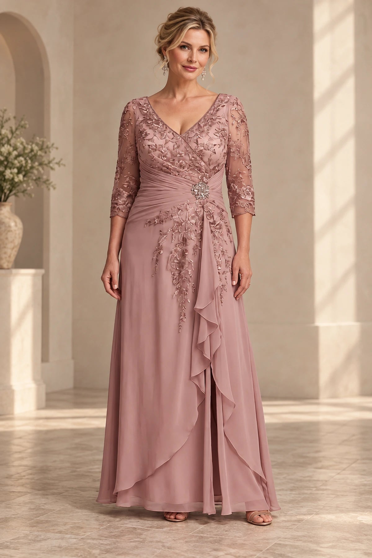 Dusty rose A-line Mother of the Bride Dress with V-neck lace bodice, three-quarter sleeves, jeweled waist and draped skirt