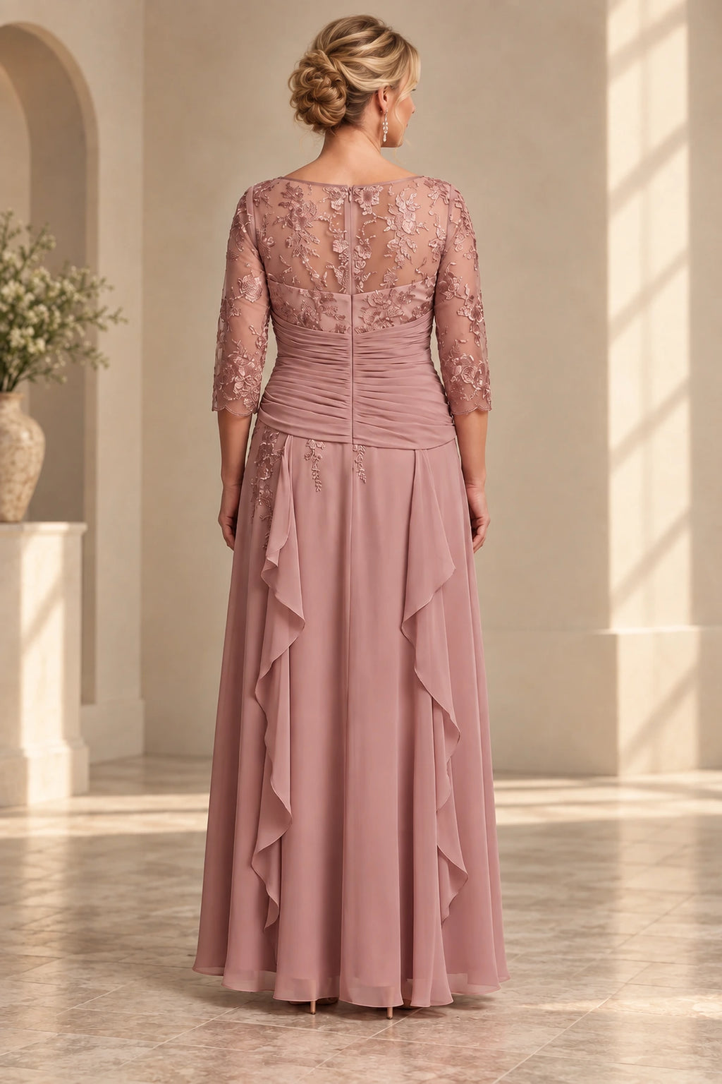 Back view of dusty rose Mother of the Bride Dress with lace upper bodice, center zipper, ruched waist and floor-length skirt