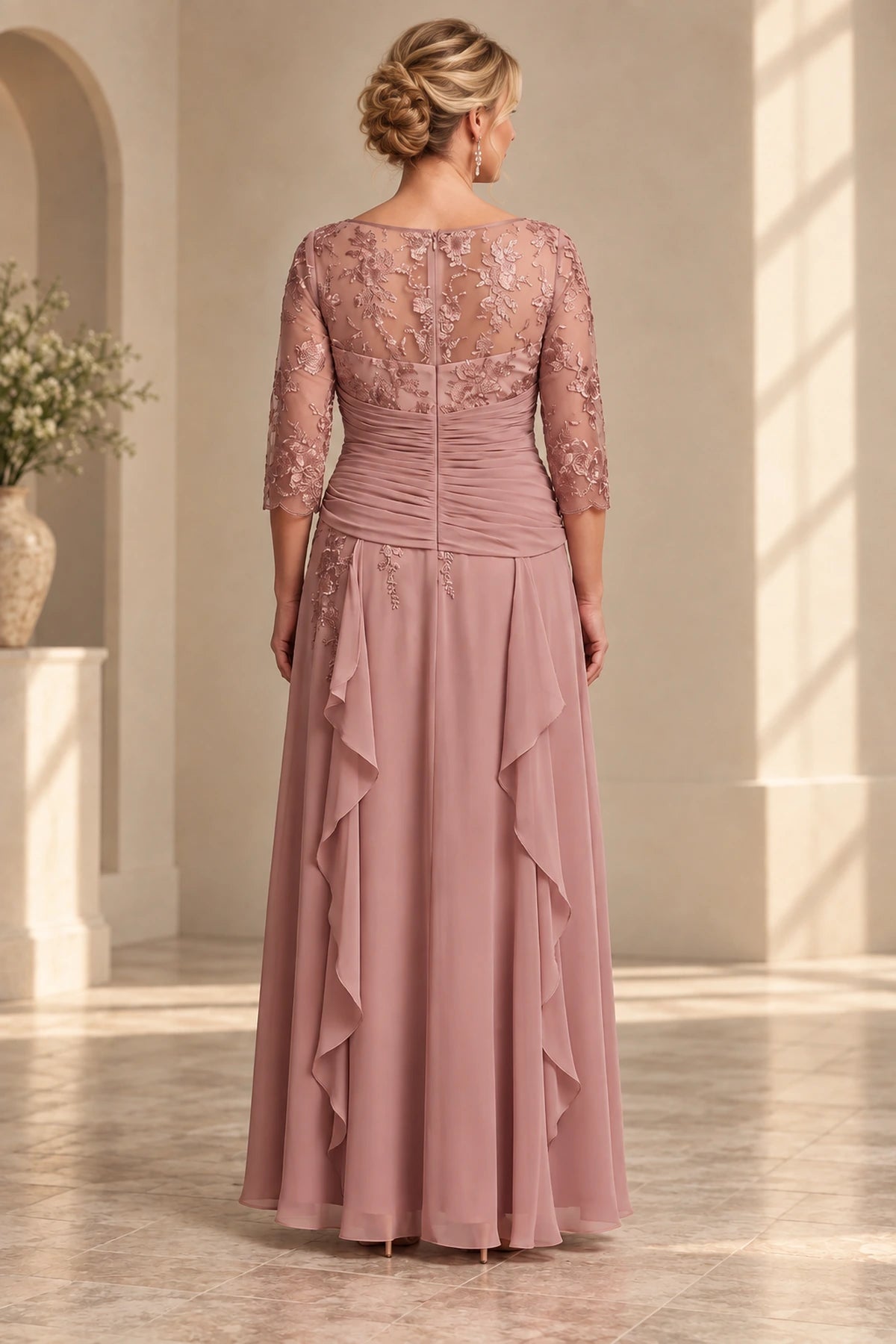 Back view of dusty rose Mother of the Bride Dress with lace upper bodice, center zipper, ruched waist and floor-length skirt