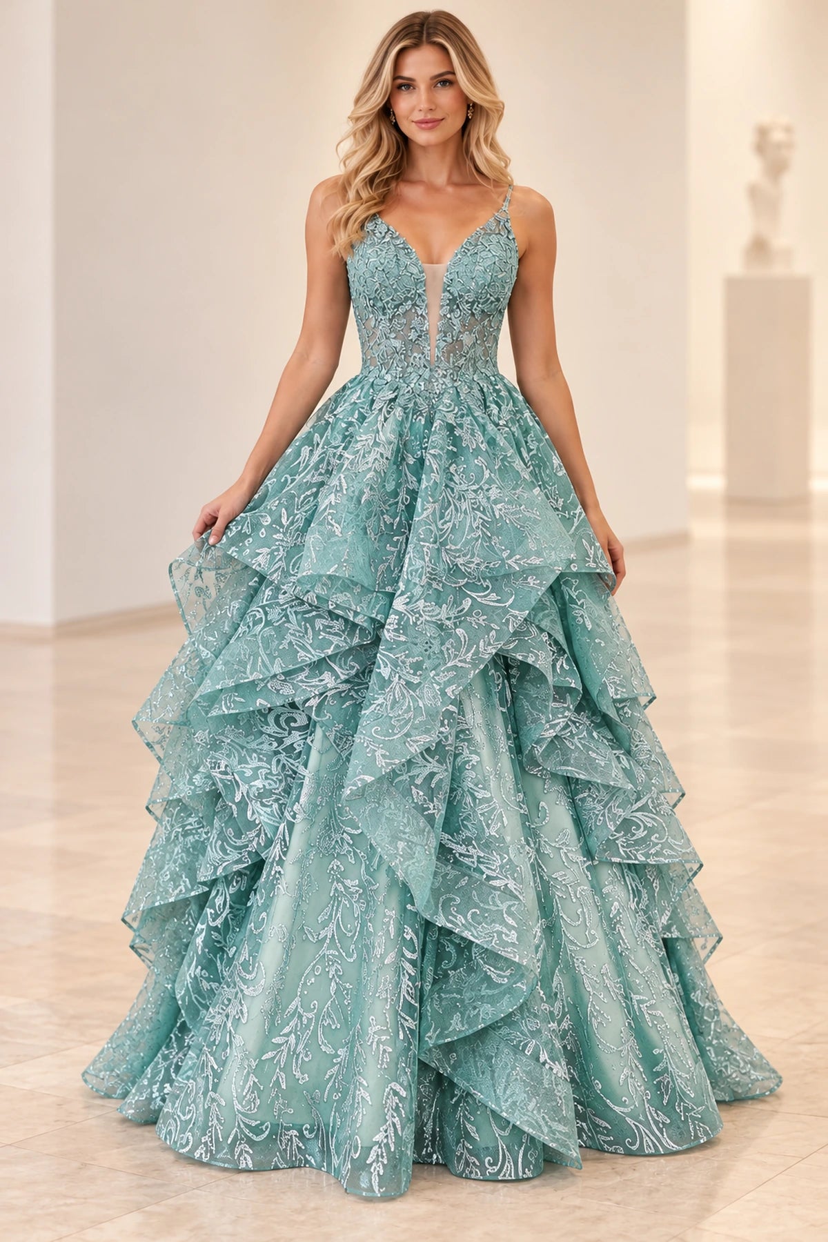 Back view of dusty sage green princess prom dress featuring a low illusion lace back, shimmering floral patterns, and voluminous tiered tulle skirt.